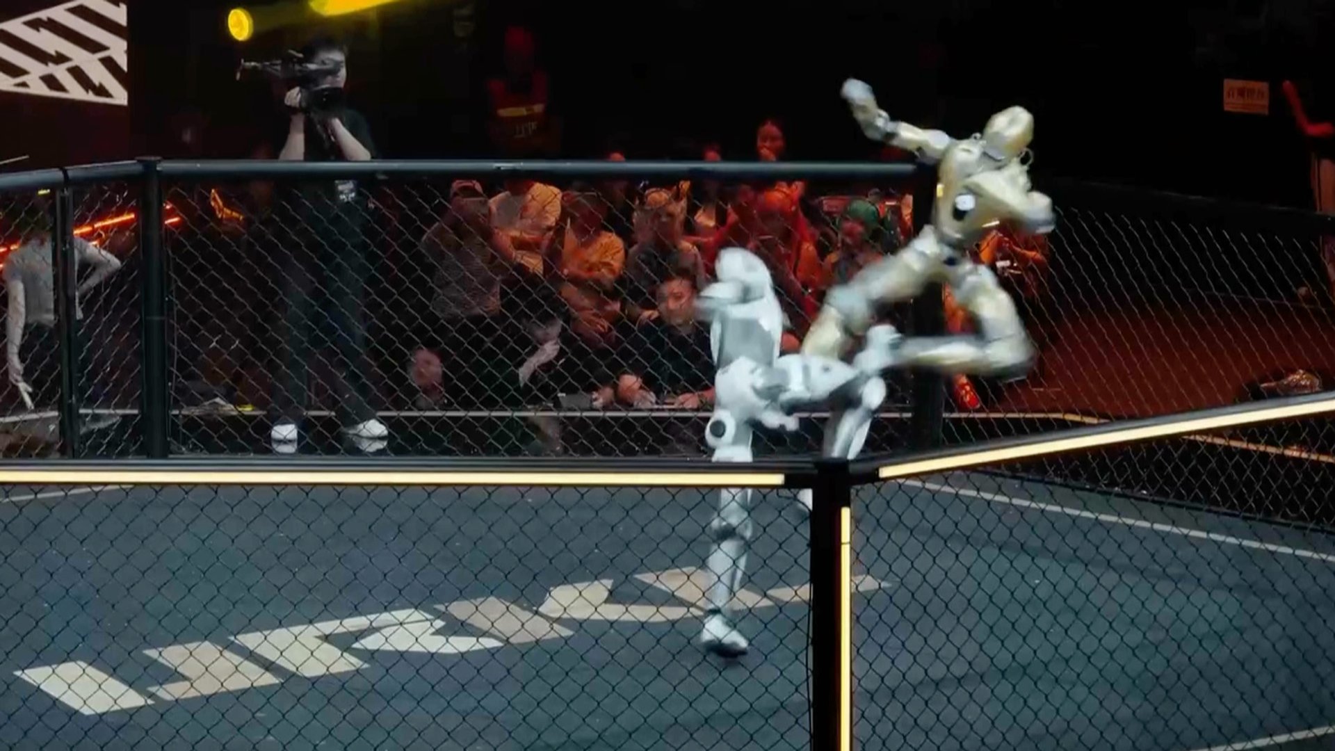 Video thumbnail for Humanoid robots fight in cage match in Shanghai