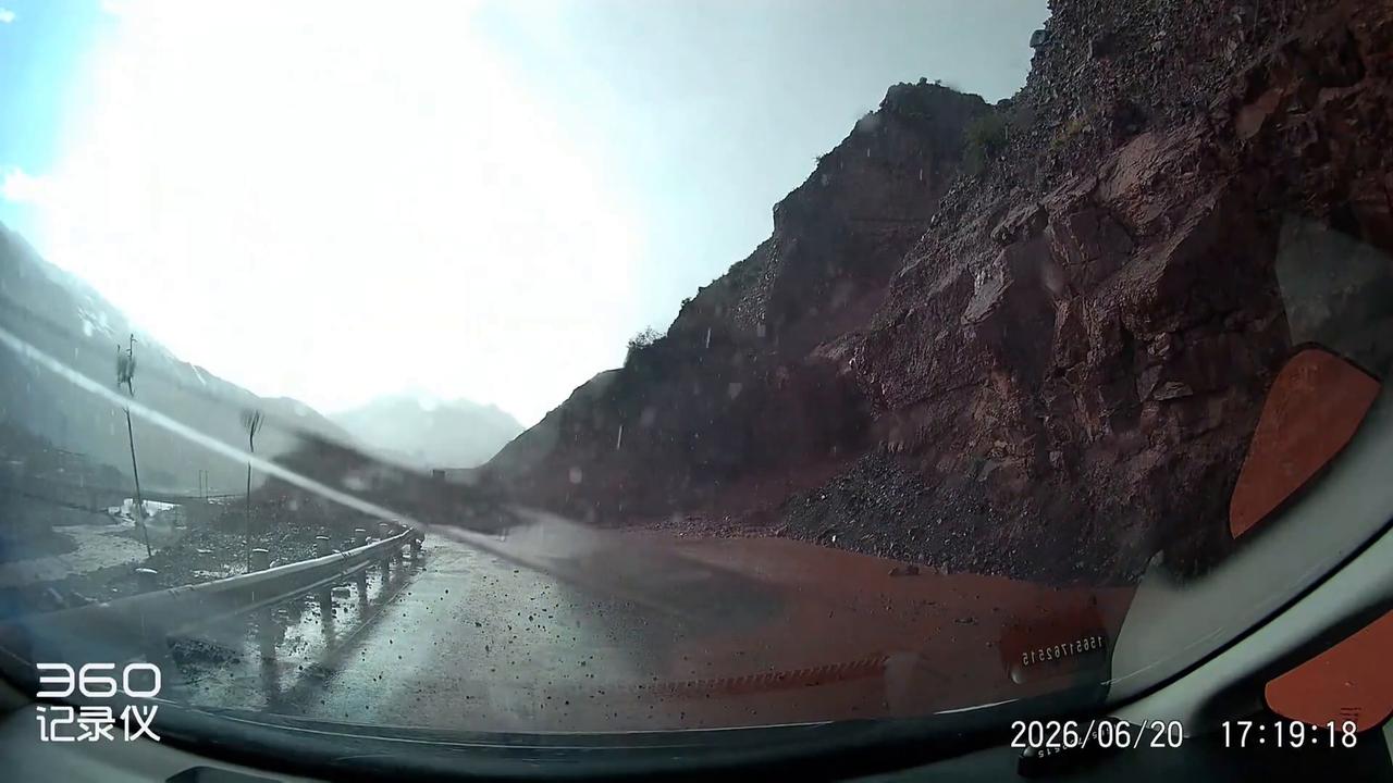 Video thumbnail for China: Chinese driver narrowly escapes mudslide after clearing rocks on mountain road.
