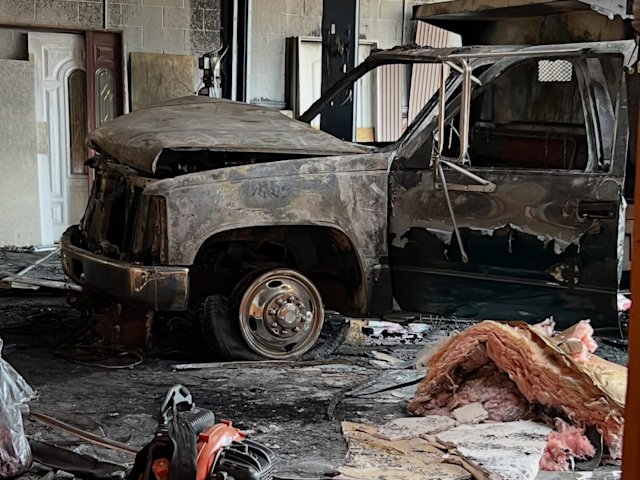 Video thumbnail for Helmet camera shows Matawan firefighters contain vehicle fire inside Route 34 shop