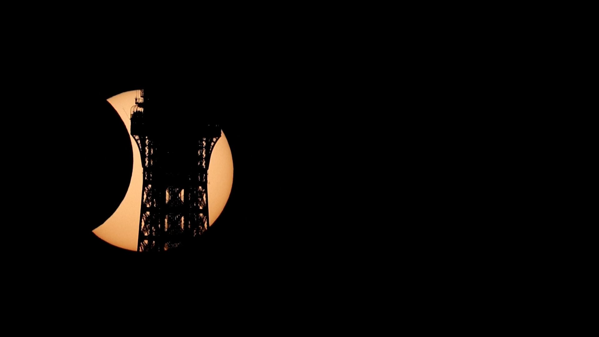 Video thumbnail for Solar eclipse carves Eiffel Tower’s silhouette in Paris sky