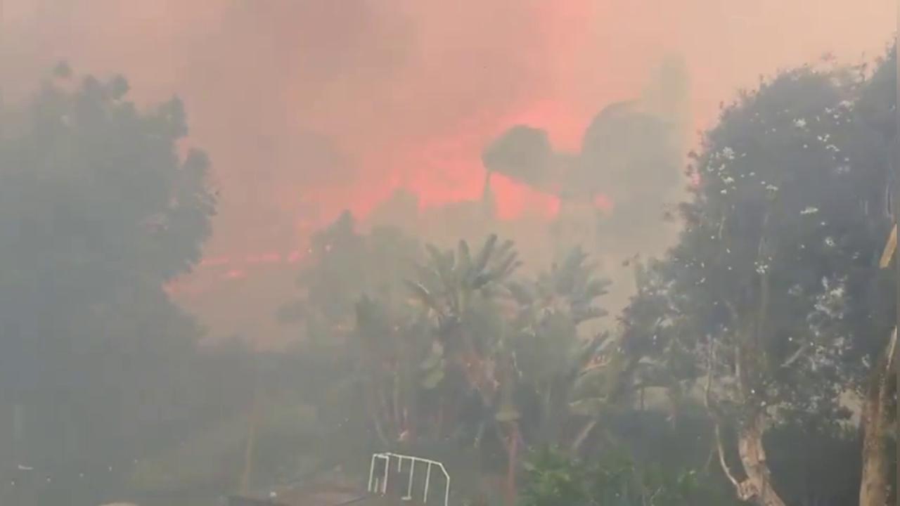 Video thumbnail for US: Inferno Rages at Backyard's Edge as Fierce Winds Fan Southern California Wildfire.