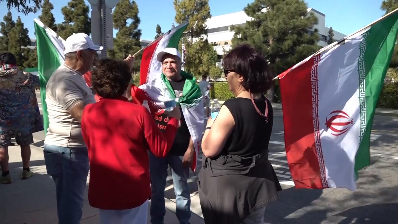 Video thumbnail for US: Rival groups clash outside Iran team hotel ahead of World Cup match (2).
