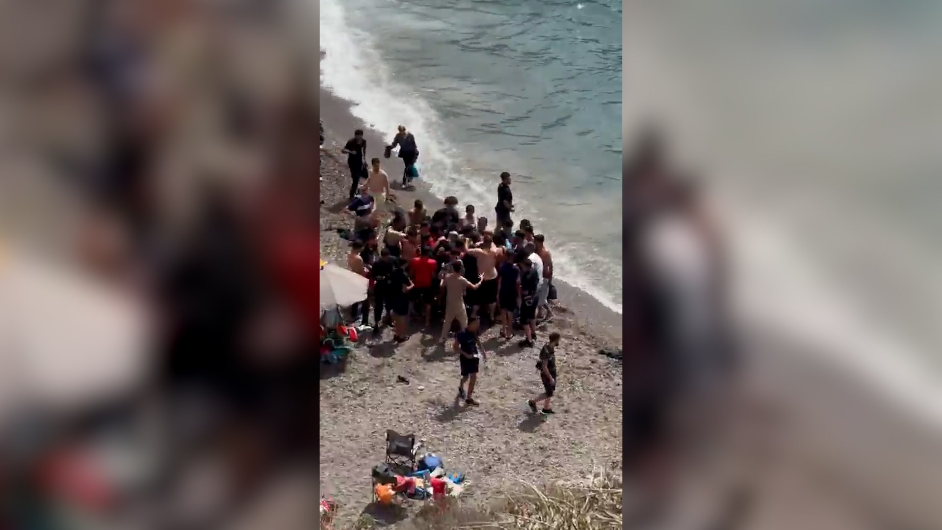 Video thumbnail for Dozens of migrants land on Spanish coast surprising beachgoers