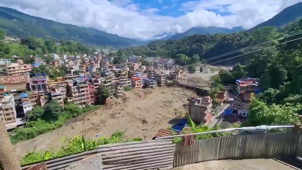 Video thumbnail for Footage from Nepal shows flash floods sweeping away several houses and a bridge near Trishuli Bazar.