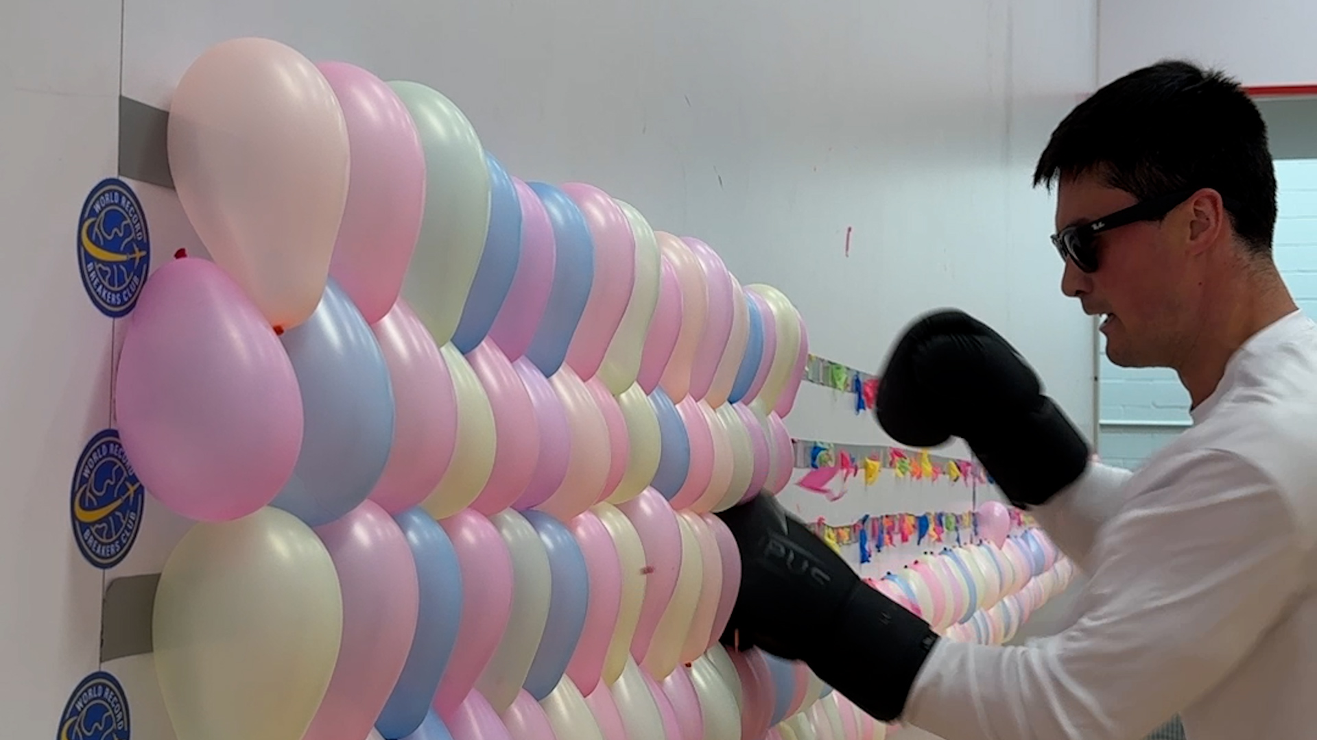 Video thumbnail for Most balloons burst with boxing gloves in one minute  602 by Johnny Buckingham