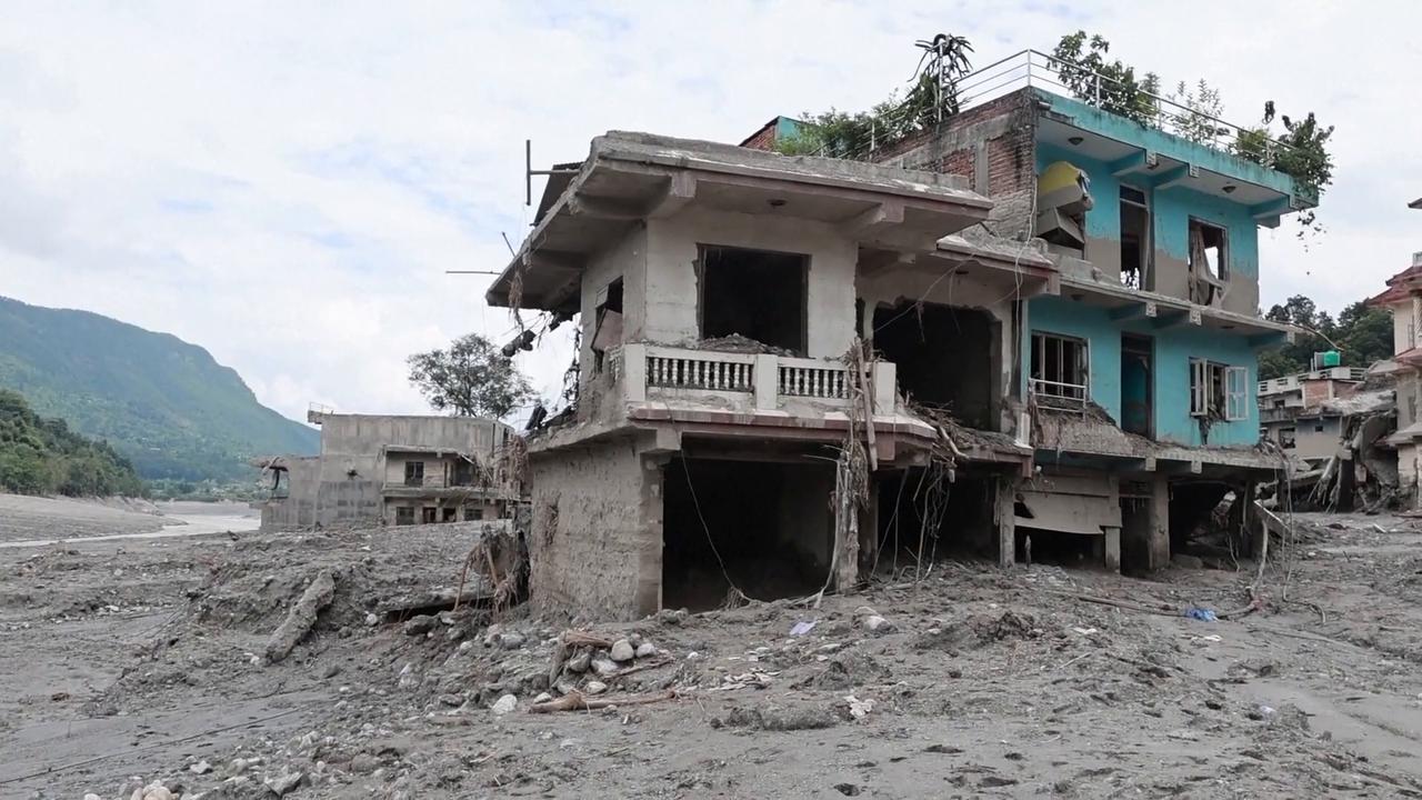 Video thumbnail for Nepal: Heavy machinery deployed as Nepali town left buried in thick layers of mud, debris.