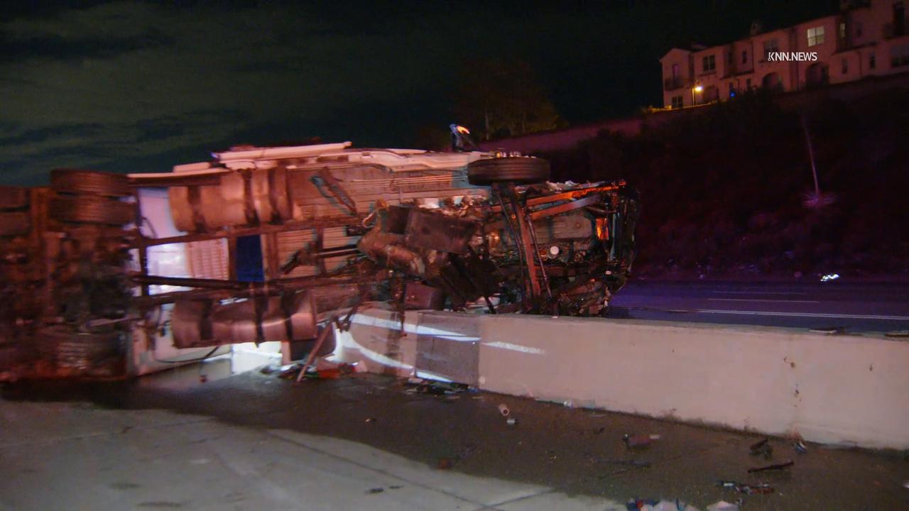 Video thumbnail for US, Los Angeles: Claremont Overturn Semi Tractor Trailer on Center Divider on 210 Fwy.