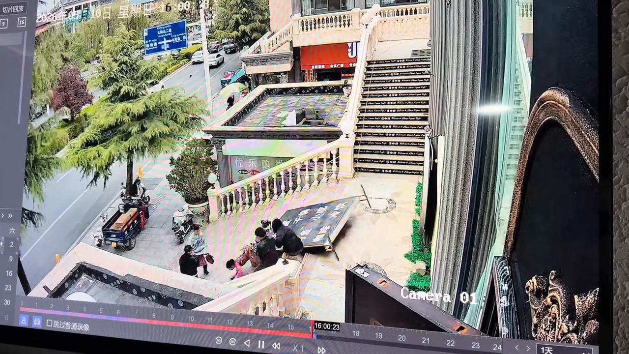 Video thumbnail for China: Chinese woman crushed by falling advertising sign while walking down stairs.