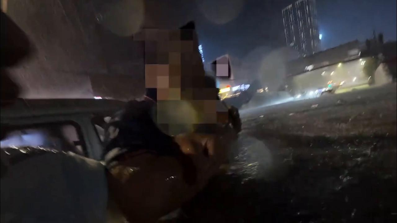 Video thumbnail for China: Police rescue trapped driver during heavy flooding in China.
