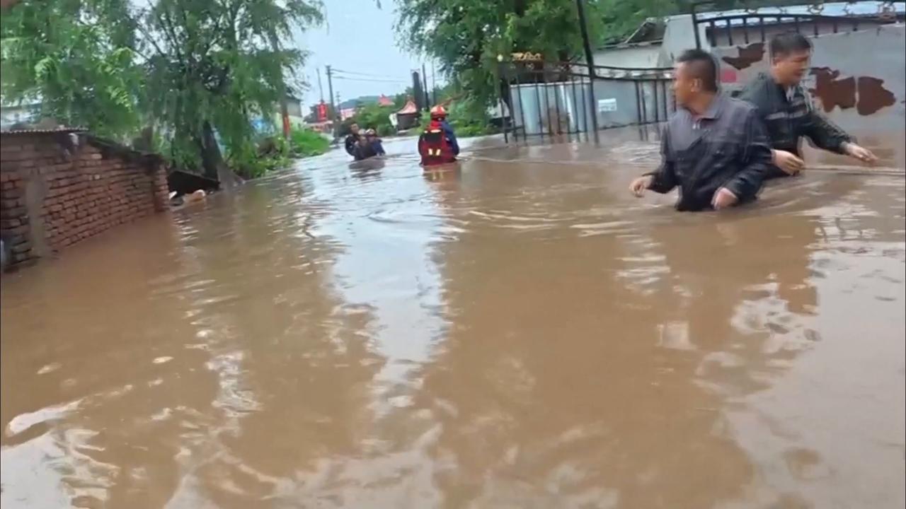 Video thumbnail for China: Firefighters rescue people trapped by floodwaters in Liaoning.