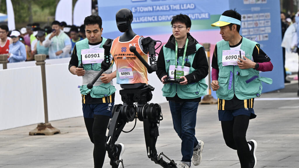 Video thumbnail for Robots race alongside humans in China half-marathon