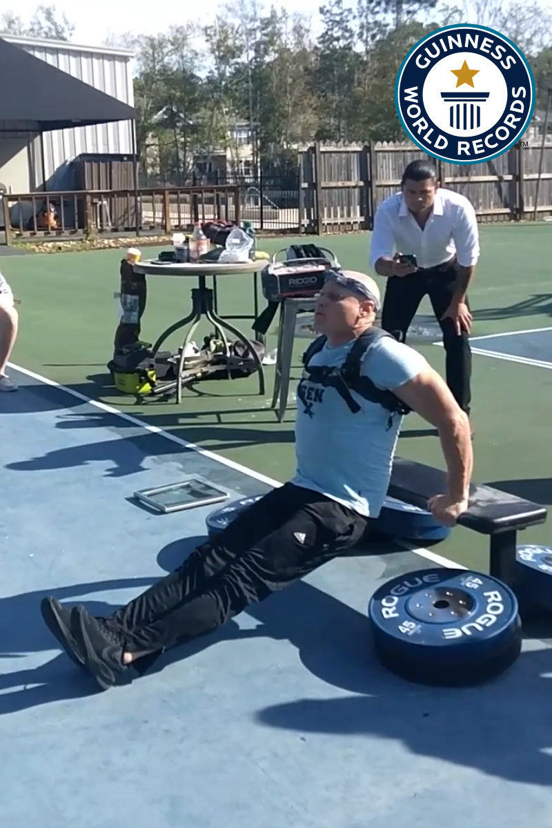 'Video thumbnail for Shawn Evans sets record for most tricep dips with a 40 lb backpack'