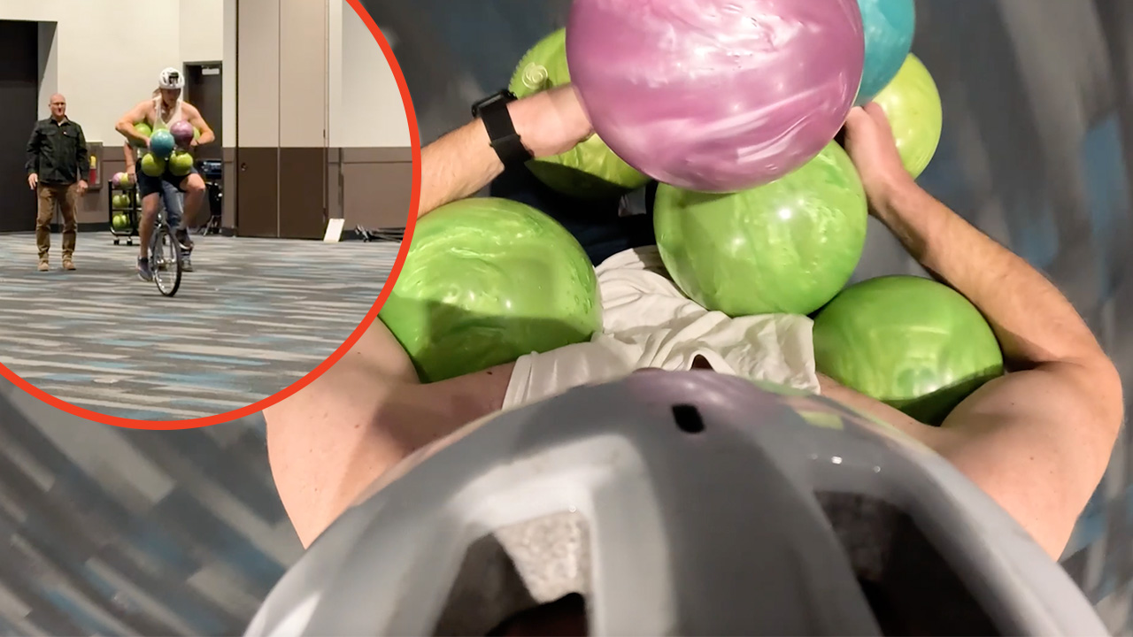 Video thumbnail for Most bowling balls held simultaneously while riding a unicycle  7 by David Rush