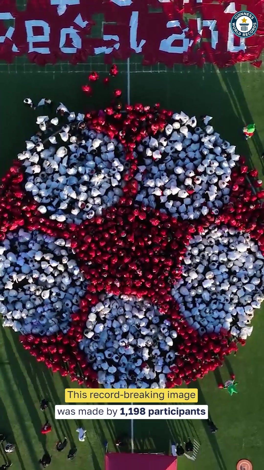Video thumbnail for Largest human image of a football (soccer ball)  1,198 people by RedsLand