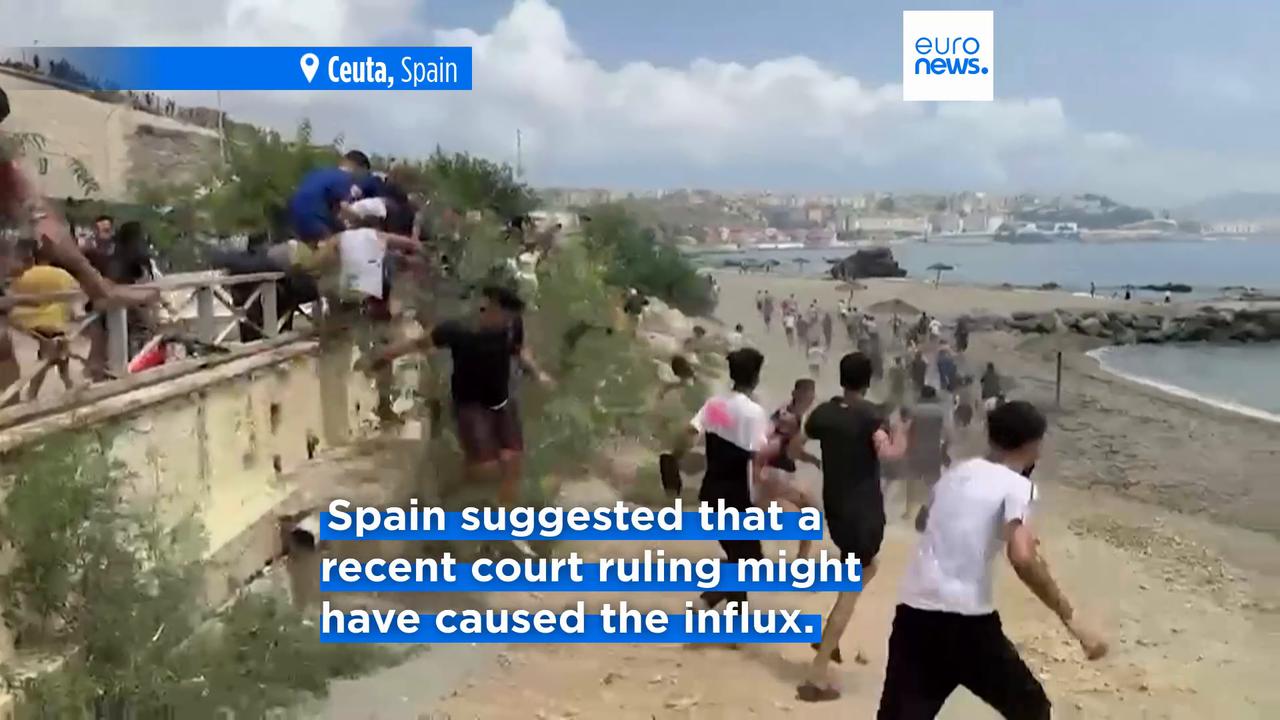 Video thumbnail for Spain mobilises troops to Ceuta as thousands of migrants continue to swim across the border from Morocco