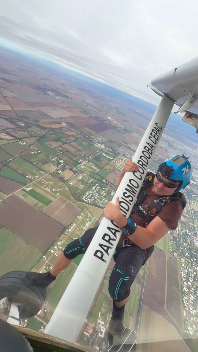 Video thumbnail for Daredevil Skydiver Climbing along a Plane Wing in Midair