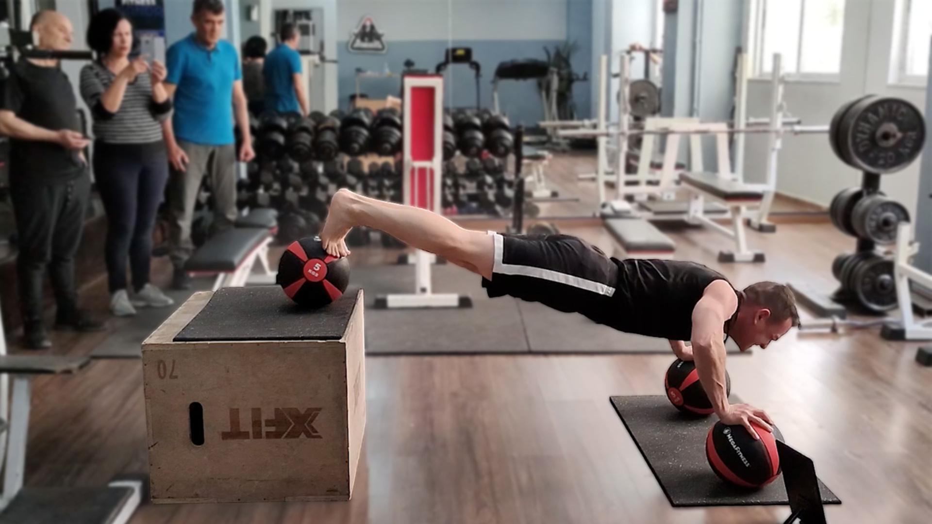 Video thumbnail for Most decline push ups on medicine balls in one minute (male)  79 by George Kotsimpos