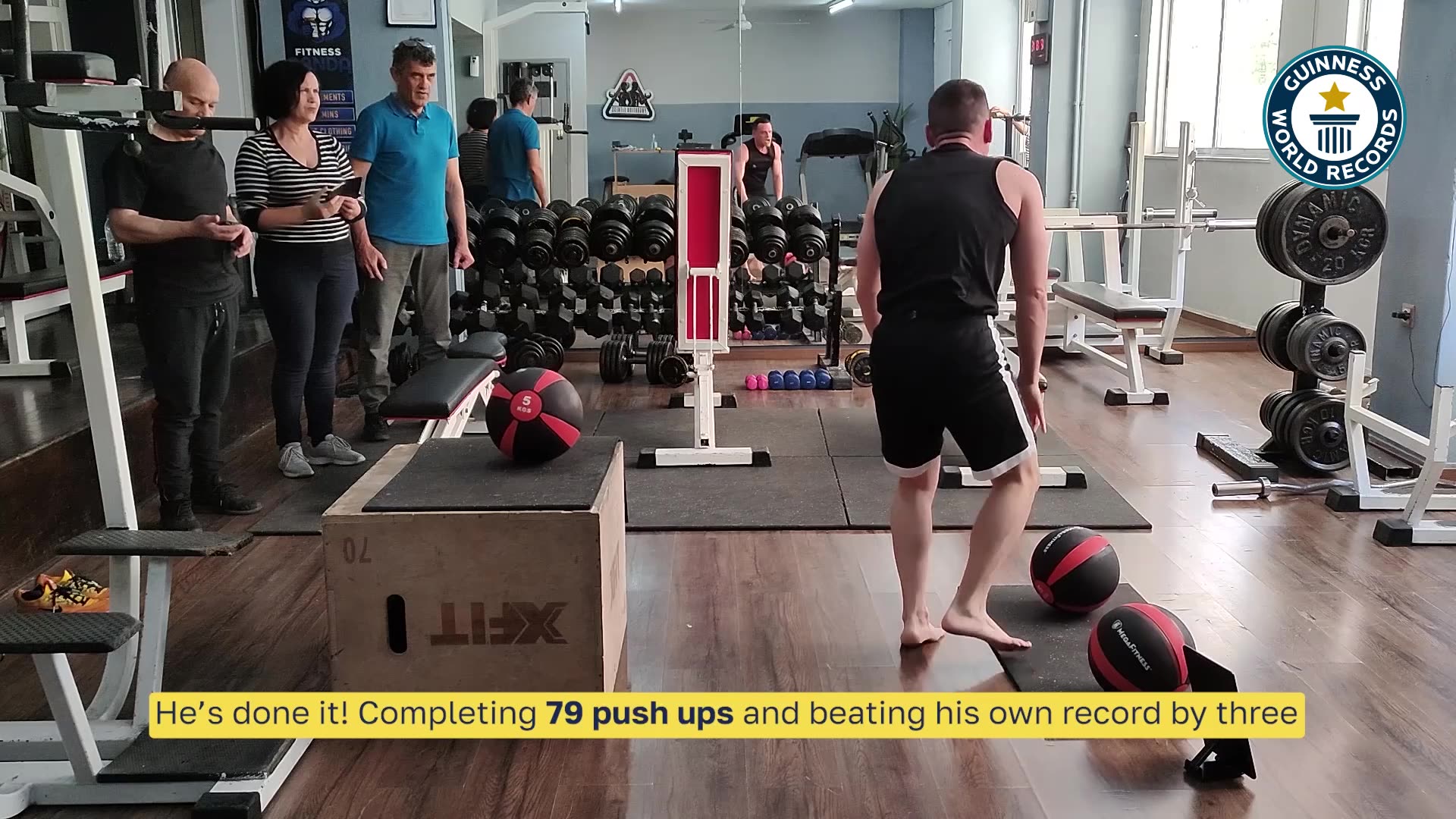 Video thumbnail for Most decline push ups on medicine balls in one minute (male)  79 by George Kotsimpos