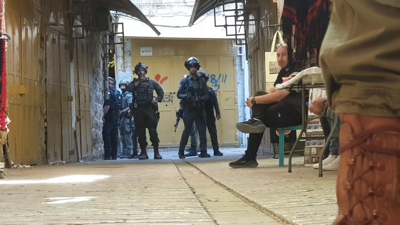 Video thumbnail for Israeli occupiers under military escort raid Old City of Hebron.