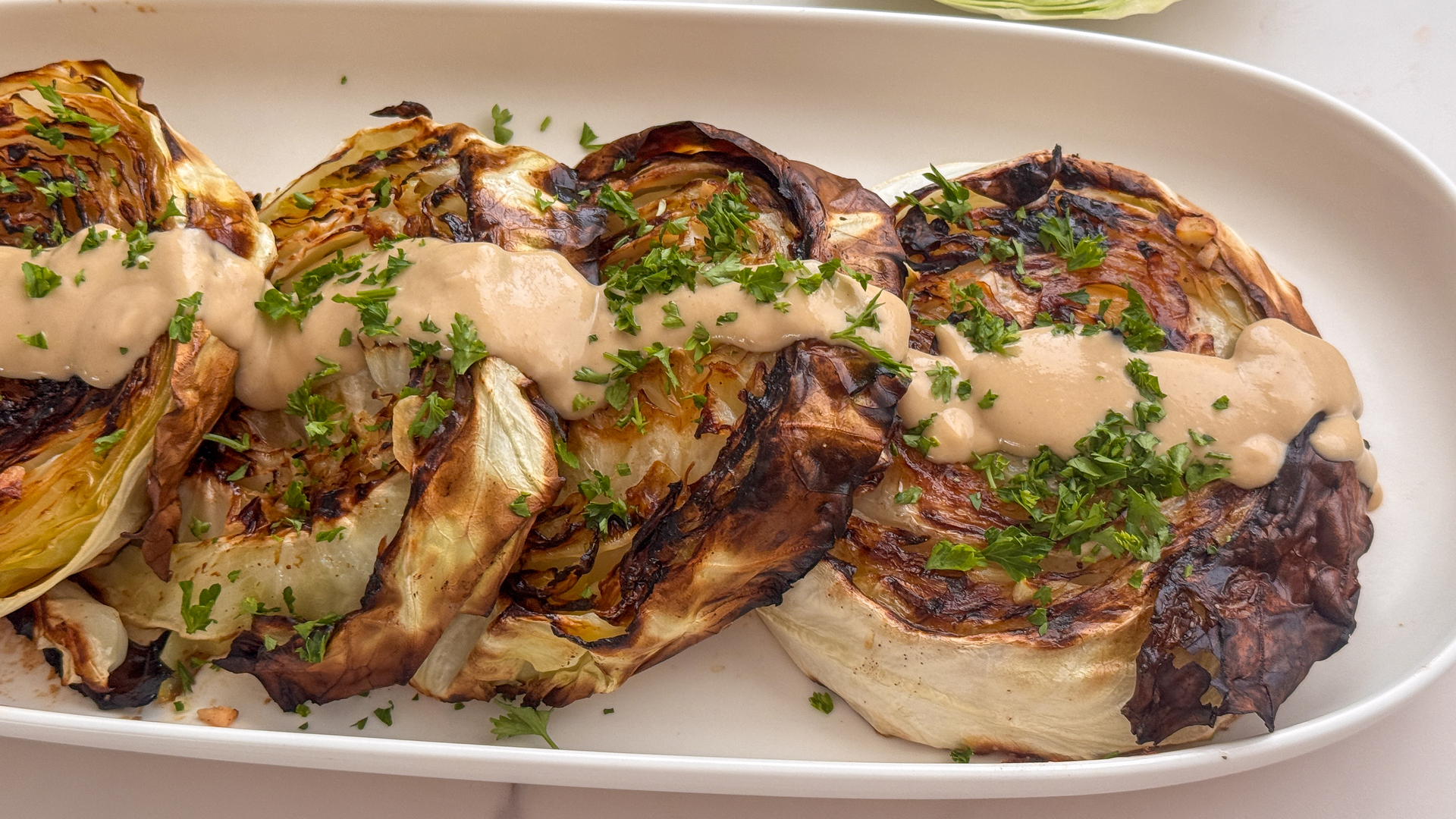 Video thumbnail for Roasted Cabbage Steaks With Miso Tahini Drizzle Recipe