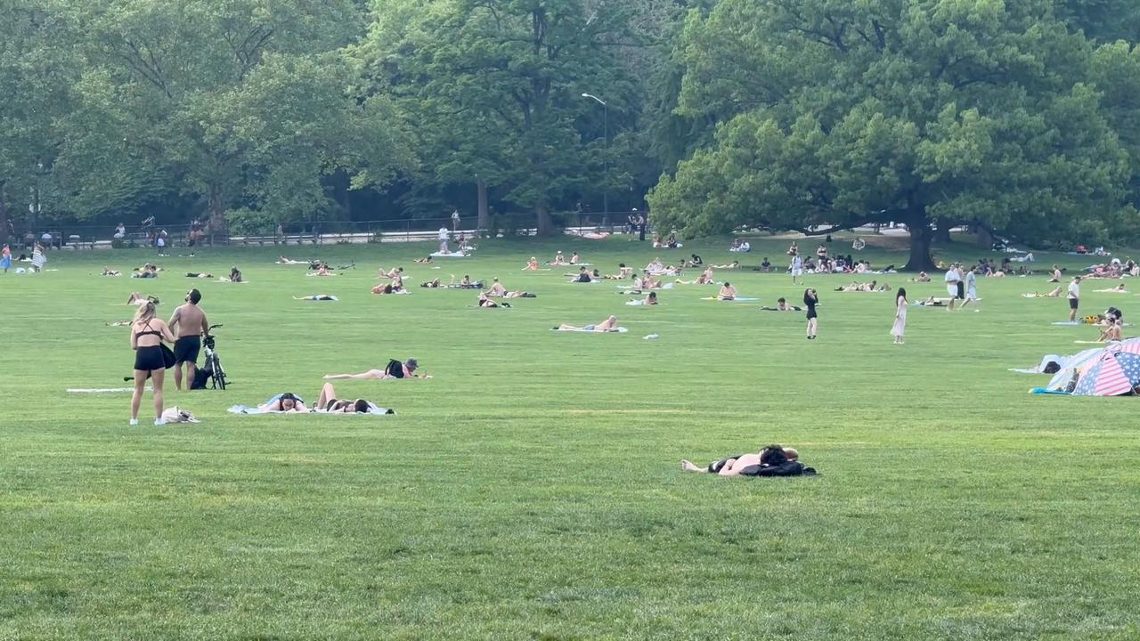 Video thumbnail for US: Central Park Great Lawn -New York City Hit with hottest weather of the year so far.