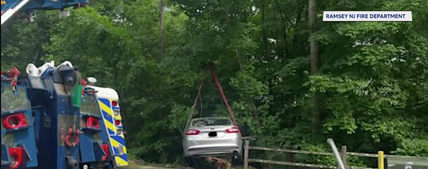 Video thumbnail for Crews rescue trapped driver after car crashes into Ramsey embankment