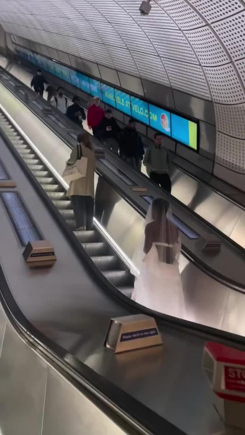 Video thumbnail for Runaway Bride on the Escalator through the Underground