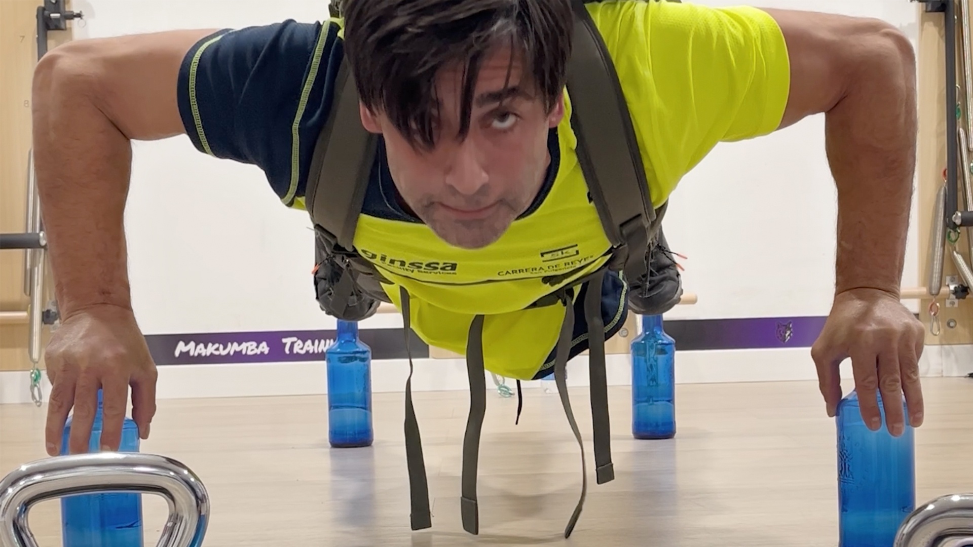 Video thumbnail for Most push ups on glass bottles carrying an 80lb pack in one minute (male) - 20 by Alejandro Soler Tari