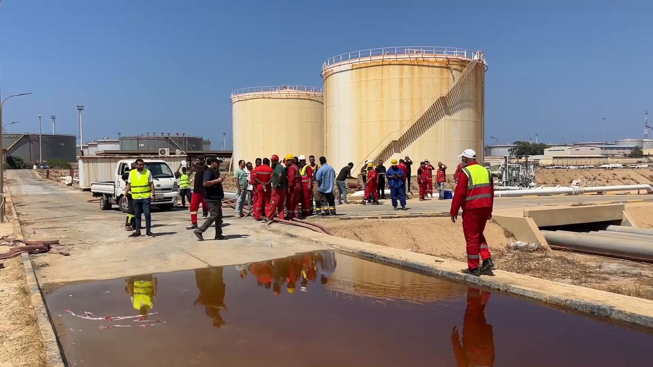 Video thumbnail for Libya: Firefighters battle blaze after drone attack at Libya's Zawiya oil refinery.