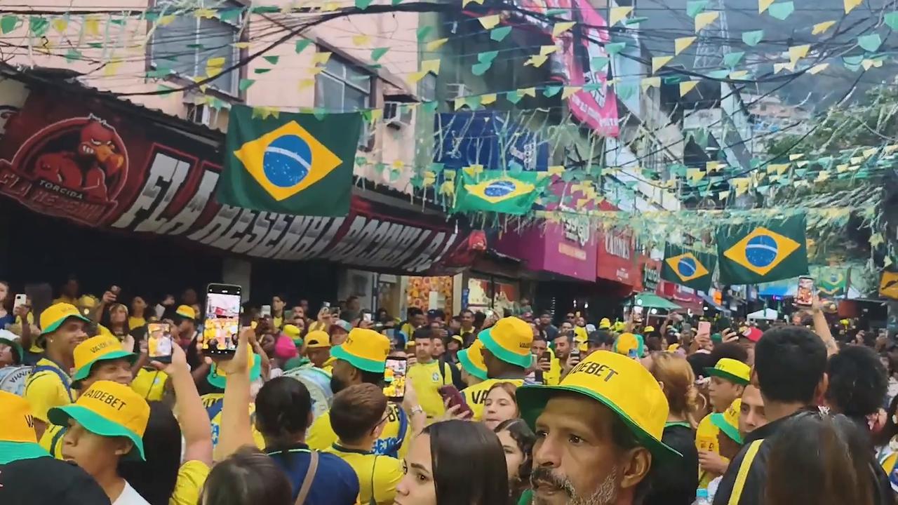 Video thumbnail for Brazil: Brazilian fans in Rocinha react as Norway knocks Brazil out of World Cup.