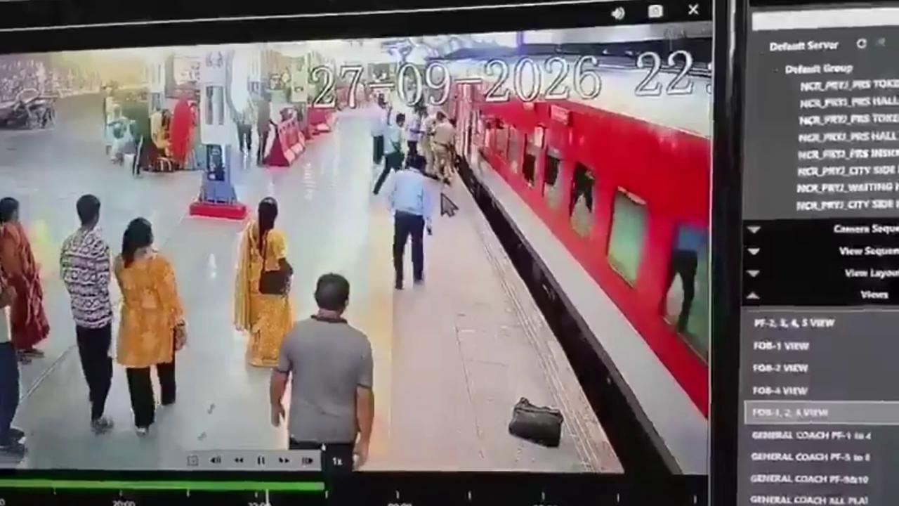 Video thumbnail for India: Woman plunges beneath moving train after losing balance at platform, quickly rescued.