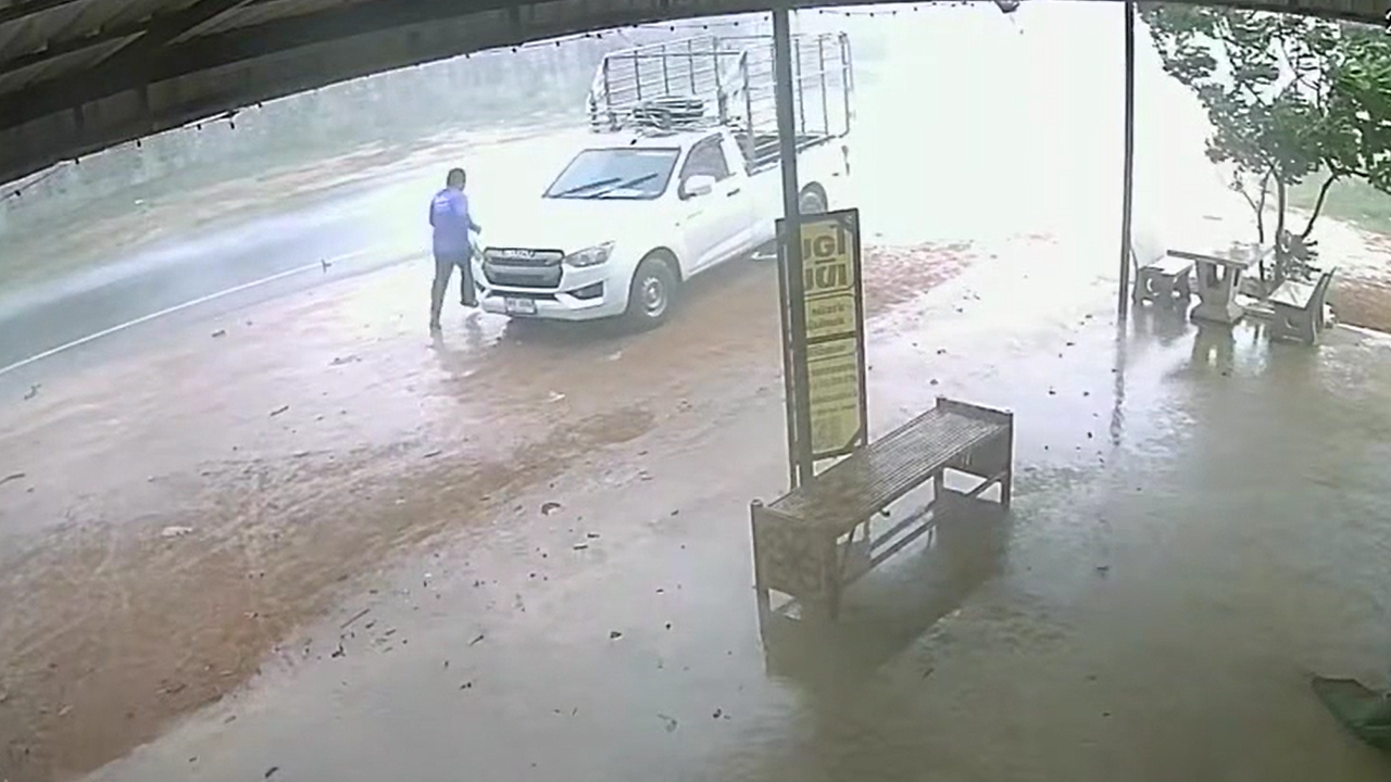 Video thumbnail for Vehicle Rolls Backward in Rain Before Driver Stops It in Sisaket