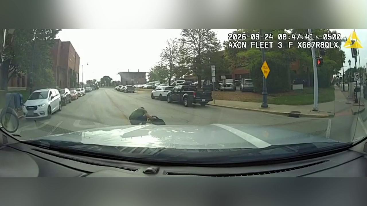 Video thumbnail for US: Cop Hits Pedestrian In Crosswalk While Driving Through Downtown Illinois.