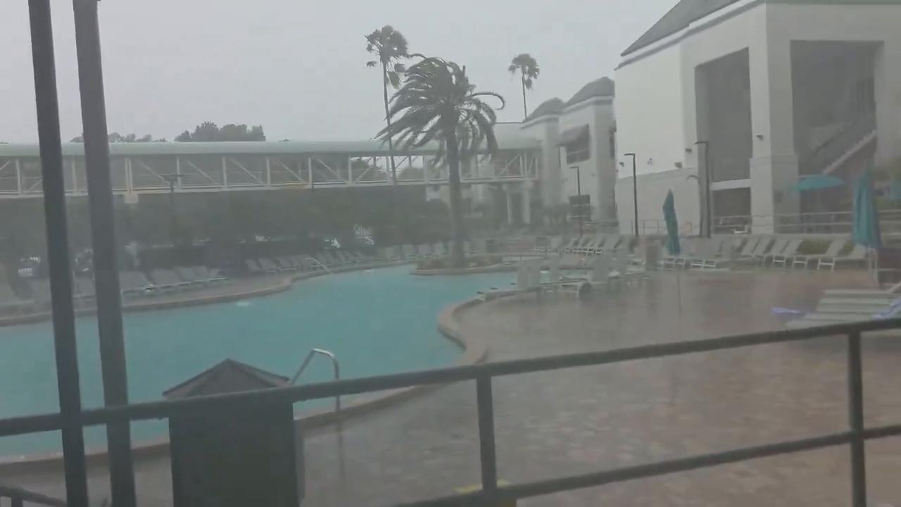 Video thumbnail for US: Storm Winds Hurl Pool Chairs Into Water at Orlando Hotel.