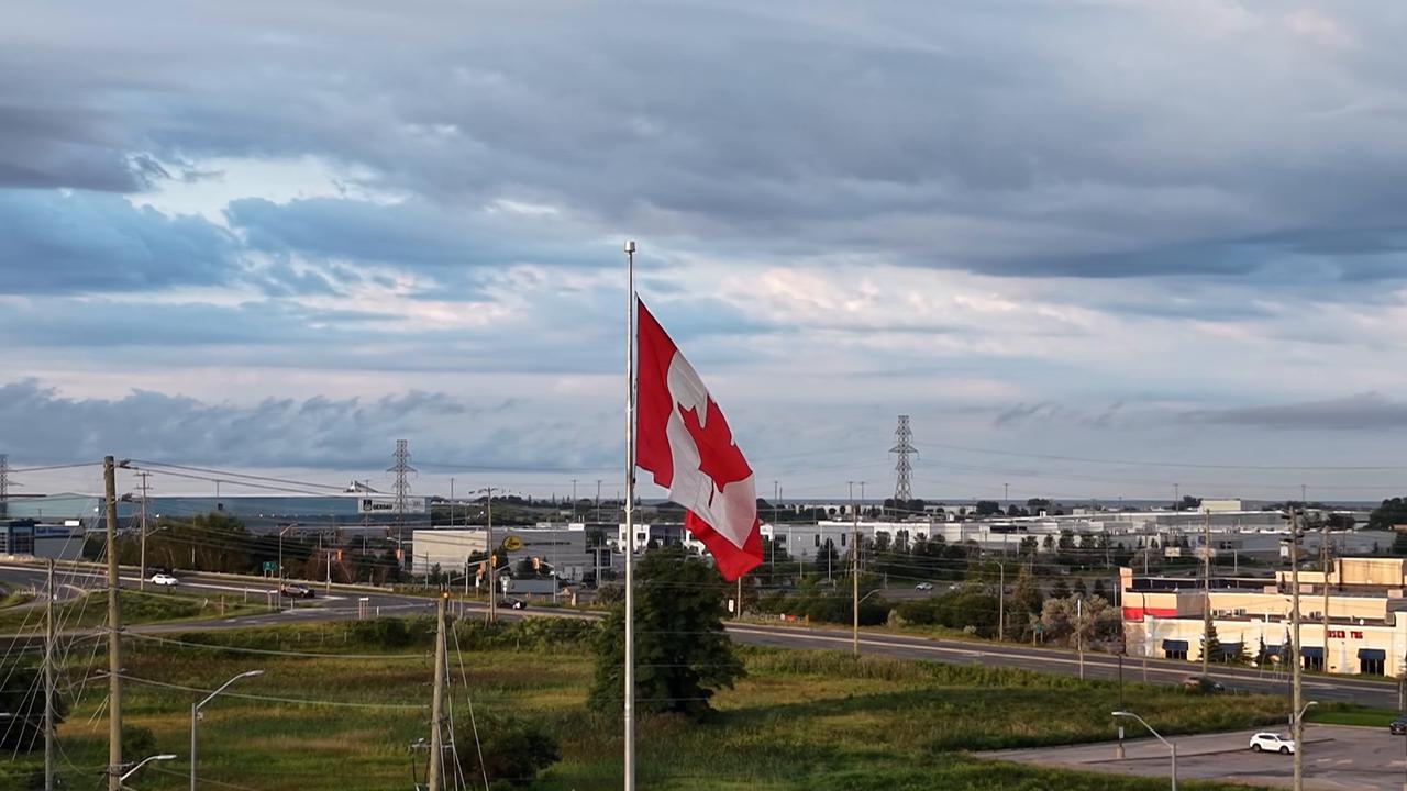 Video thumbnail for Canada: Canadian Flag at Sunrise Over Markham, Ontario.