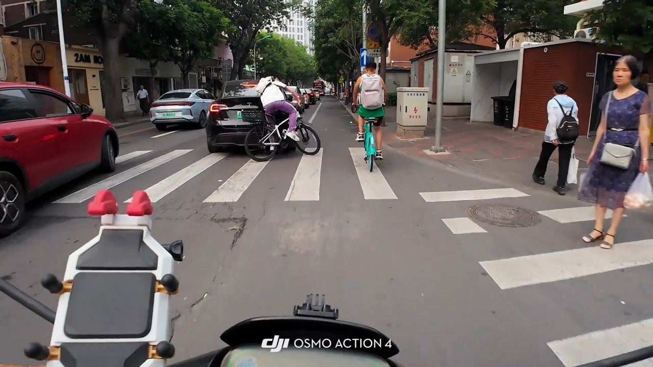 Video thumbnail for Cyclist Crashes Into Car at Bustling Tianjin Intersection