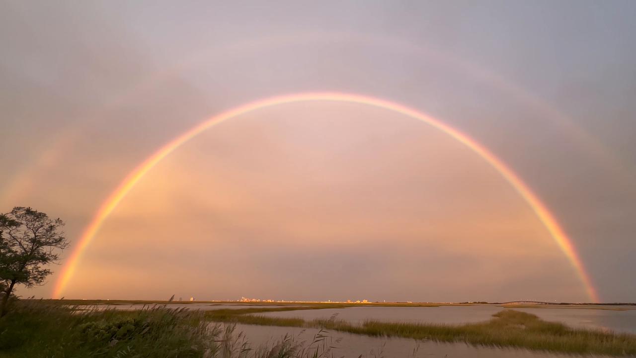 Video thumbnail for US: Brilliant Full Rainbow Appears Over Somers Point During Nor’easter.
