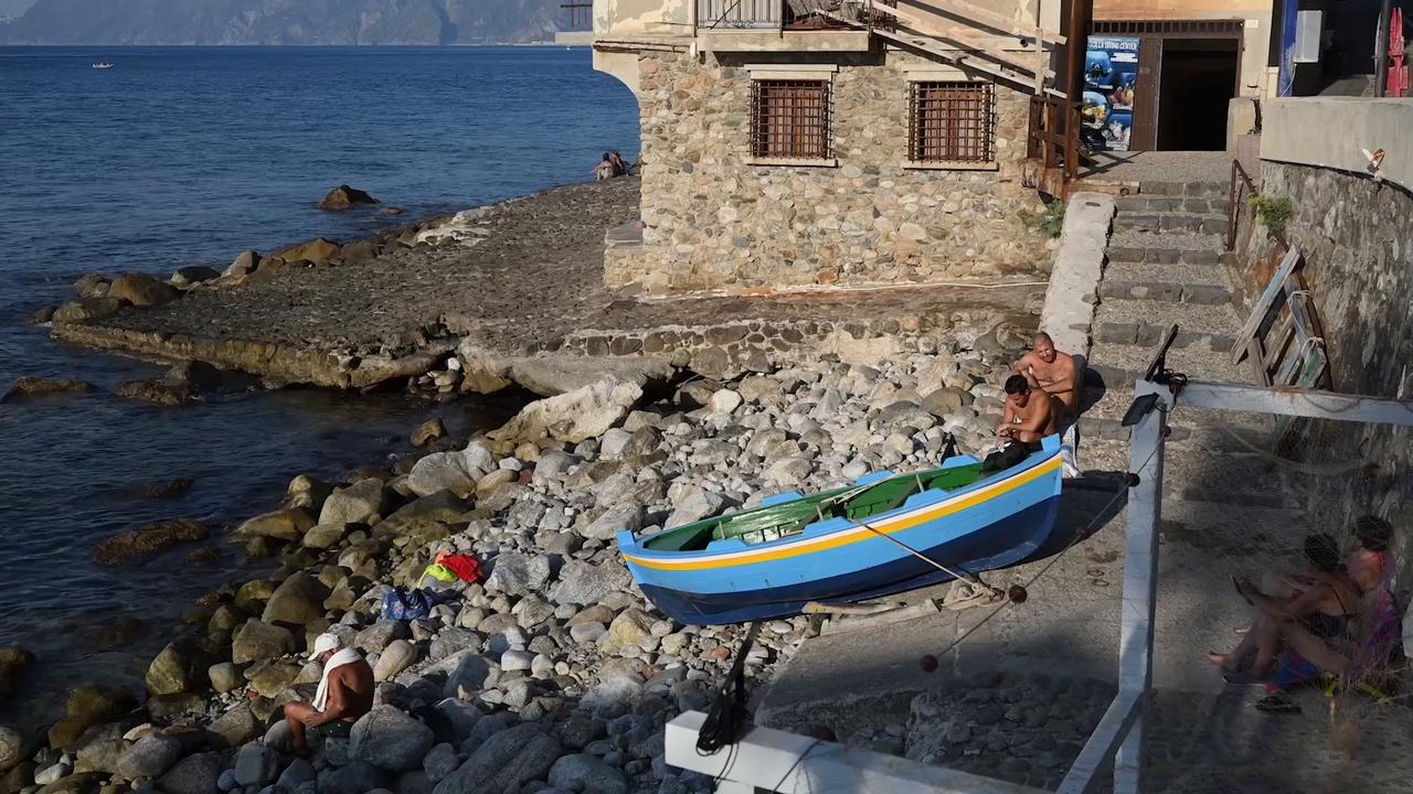 Video thumbnail for Italy: Ferragosto brings summer crowds to Italy’s coastal town of Scilla.