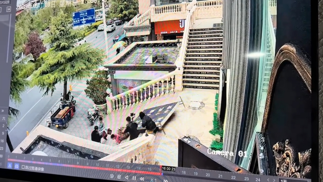 Video thumbnail for Huge Sign Falls on Woman at Tibet Courtyard Entrance