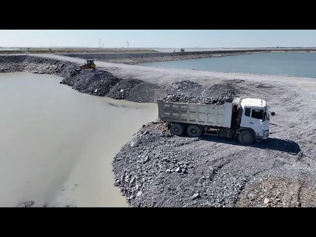 Video thumbnail for Amazing Huge Lake Filling Stone Using Bulldozer Push Stone and Dump Truck Unloading Stone in Proc