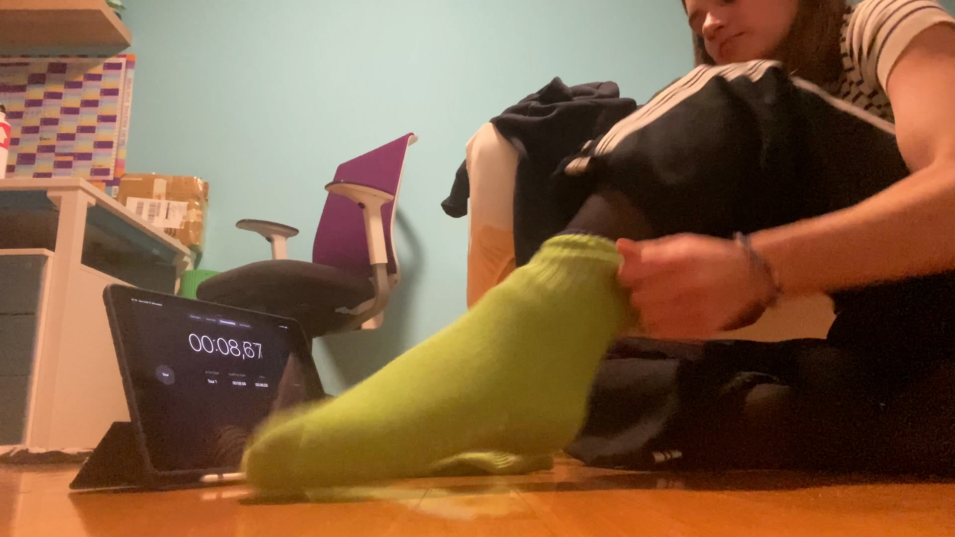 Video thumbnail for Fastest time to put on 10 socks on one foot - 11.61 seconds by Hana Bele