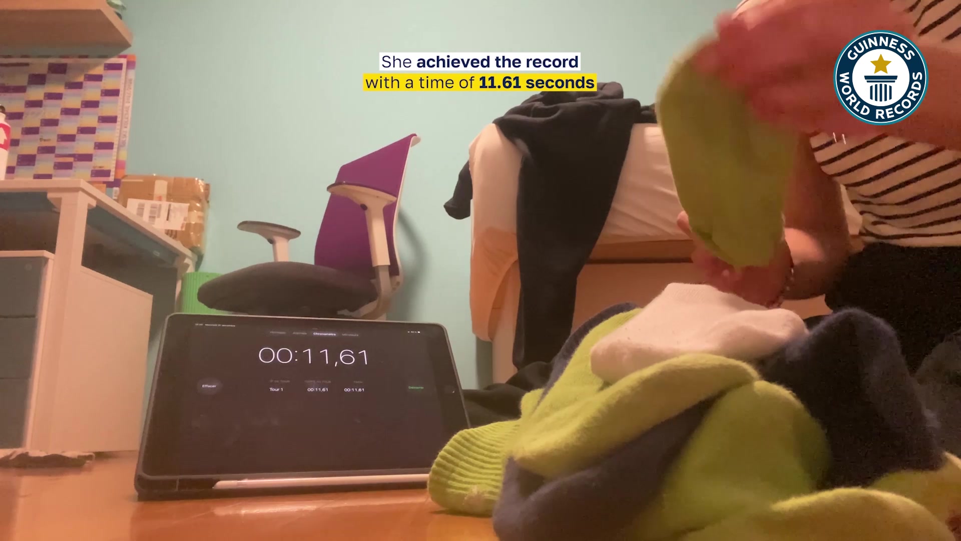 Video thumbnail for Fastest time to put on 10 socks on one foot - 11.61 seconds by Hana Bele