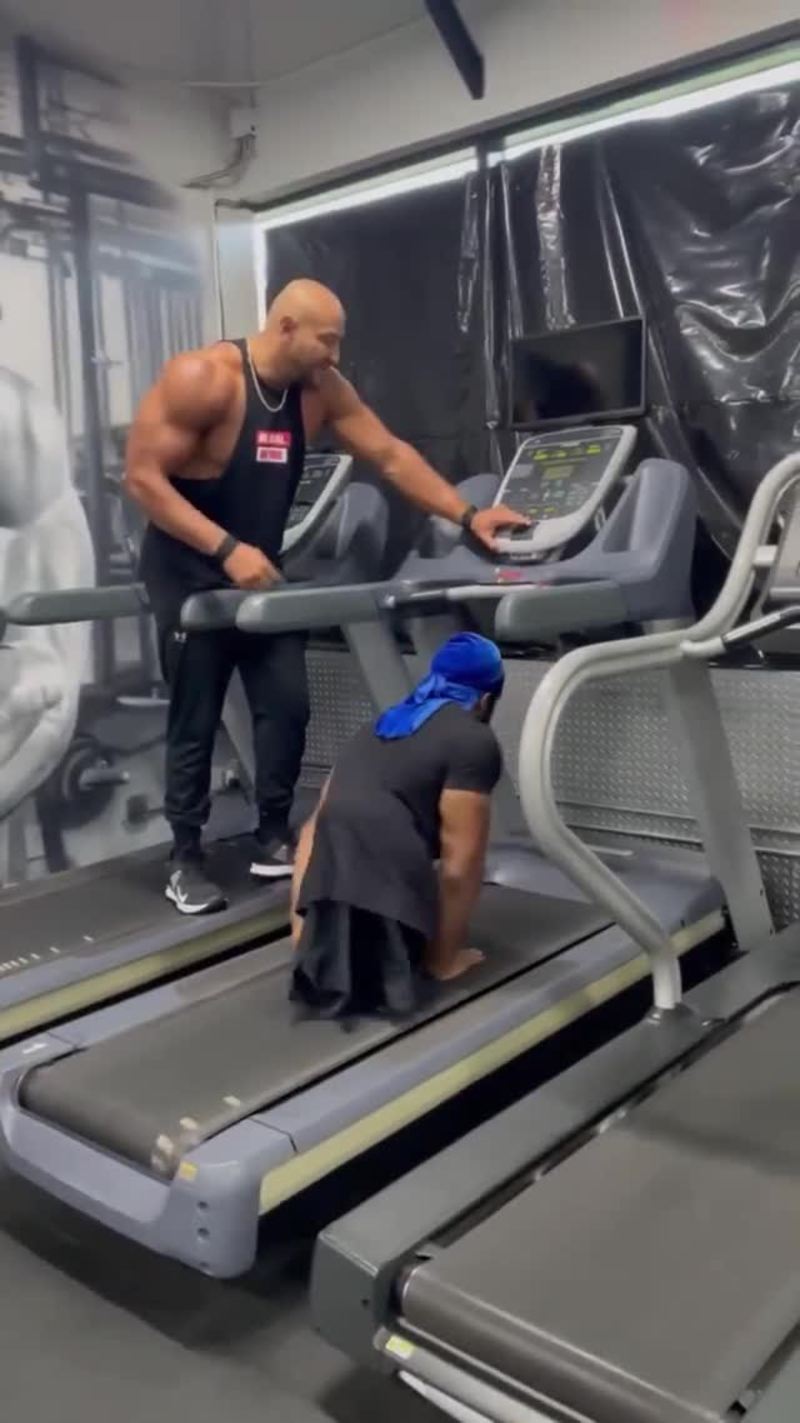 Video thumbnail for Athlete Powerfully Sprinting on Hands on a Gym Treadmill