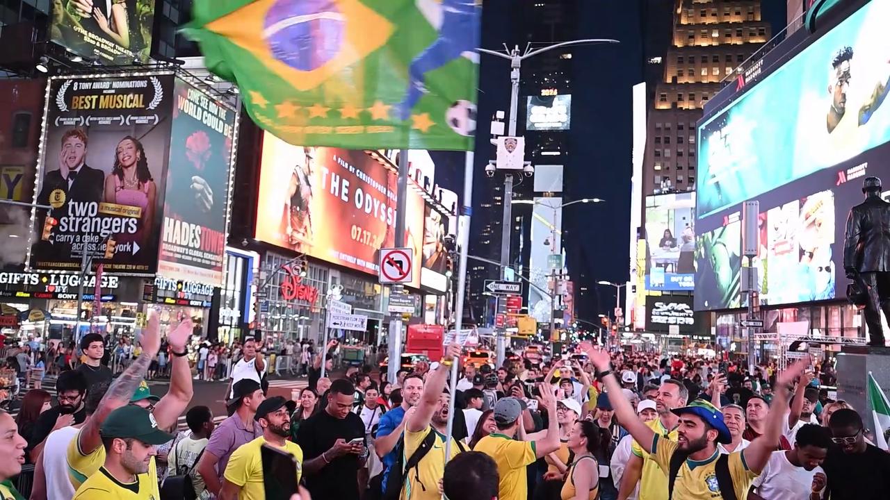 Video thumbnail for US: Brazil fans celebrate World Cup last-16 berth in New York's Times Square.