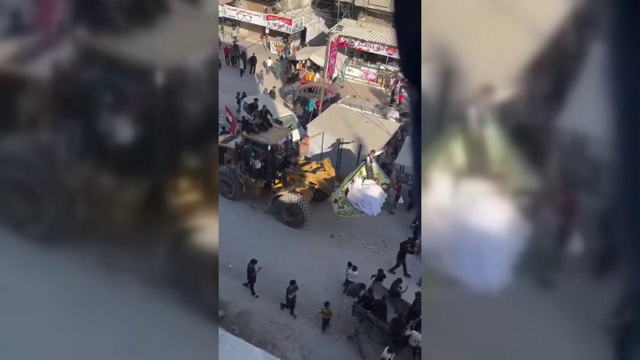 Video thumbnail for Couple Holds Wedding Ride on Construction Loader Amid Gaza Ruins.
