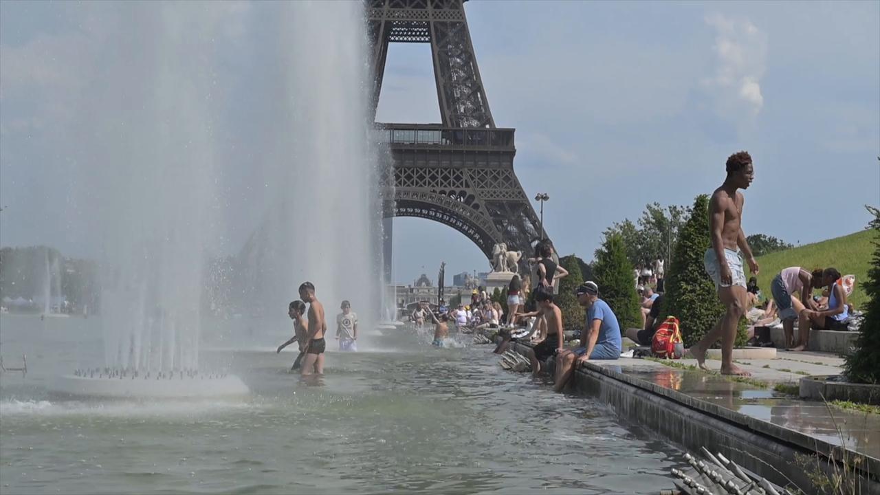 Video thumbnail for France: Parisians seek relief in fountains amid scorching heatwave.