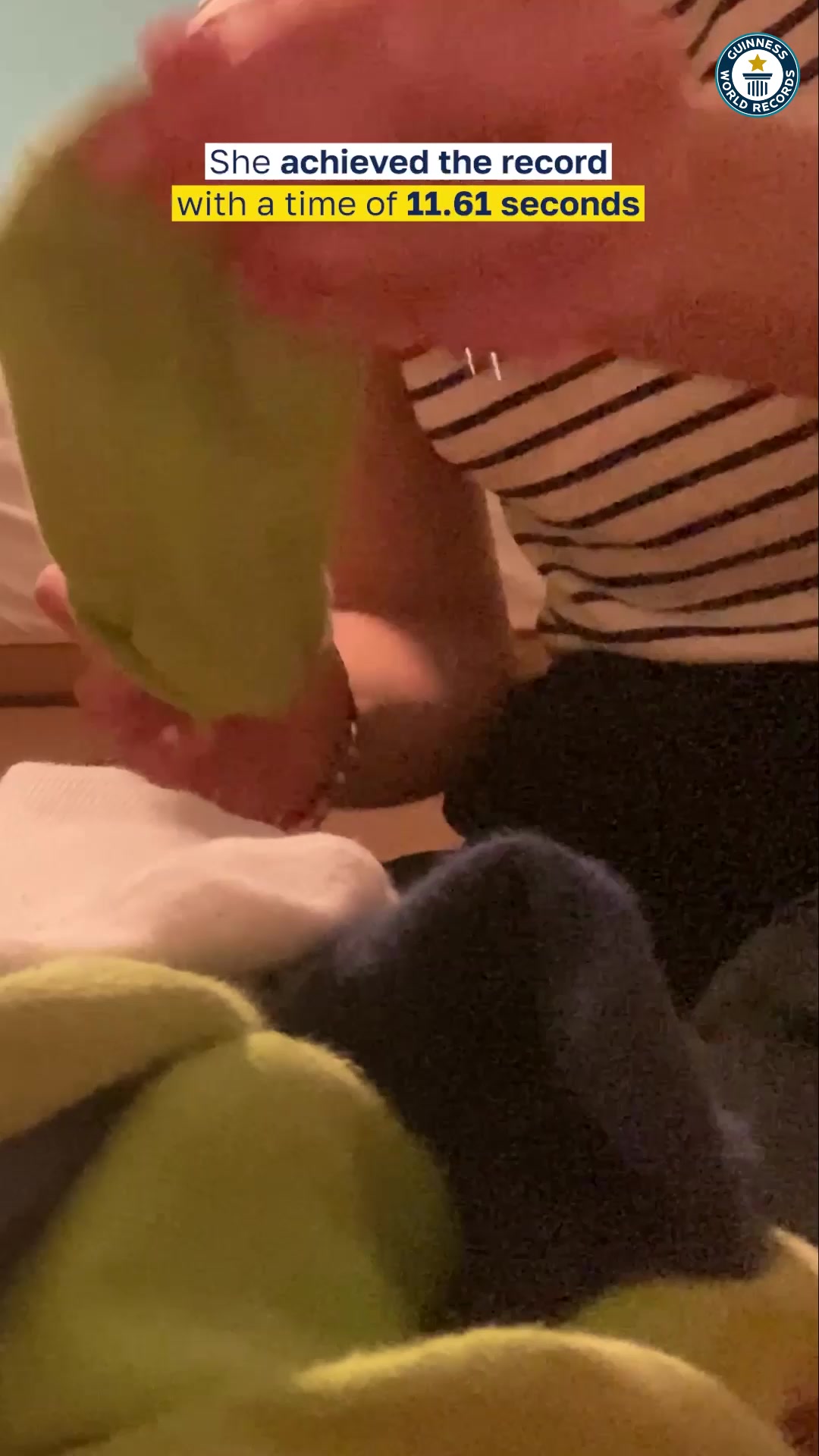 Video thumbnail for Fastest time to put on 10 socks on one foot - 11.61 seconds by Hana Bele