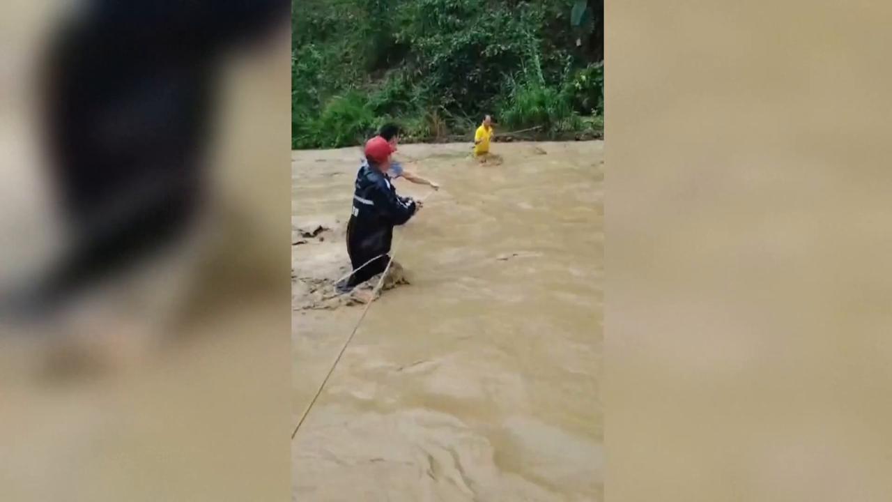 Video thumbnail for China: Rescuers brave heavy rain to evacuate flood-stranded residents in Guangxi, Inner Mongolia.