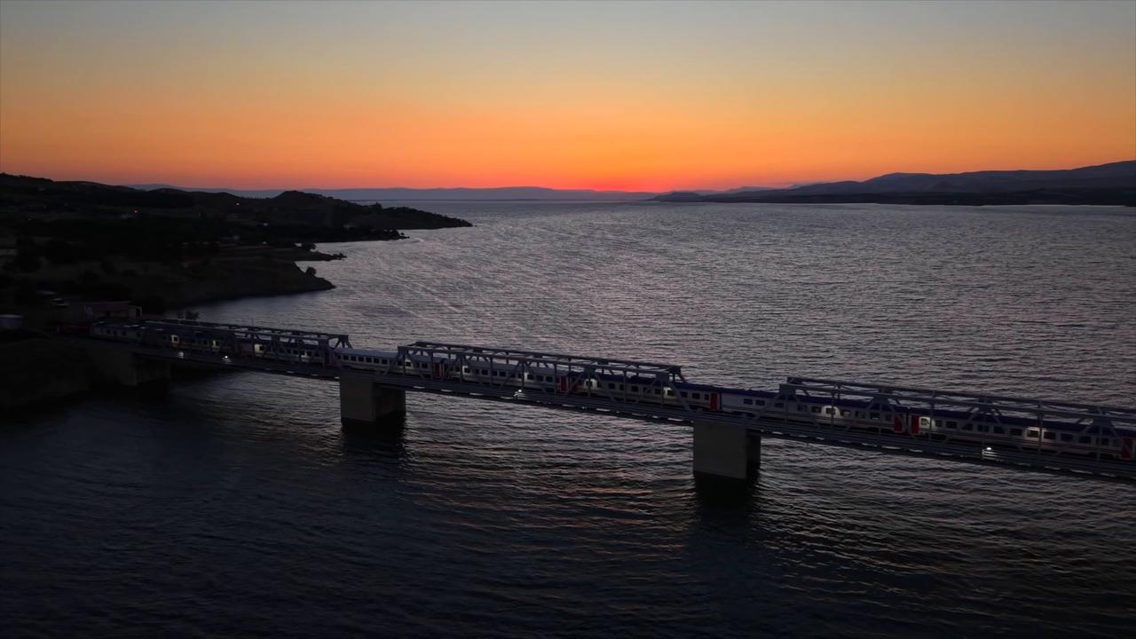 Video thumbnail for Türkiye: Stunning drone footage captures Türkiye’s longest railway bridge over Euphrates at sunset.
