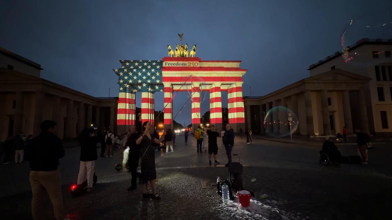 Video thumbnail for Germany: US flag colors light up Brandenburg Gate for 250th anniversary.